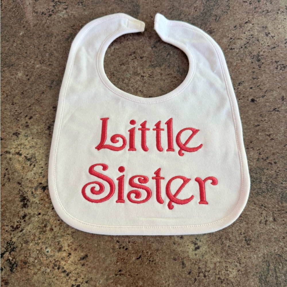 Little Sister pink bib with dark pink font